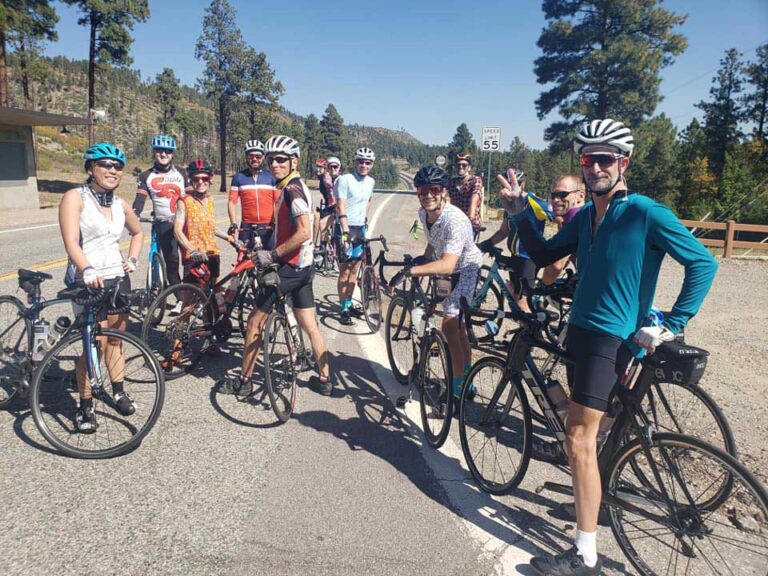 Group of bikers stoped on a road to take a photo
